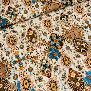 Voile crêpe zand met oranje folklore print